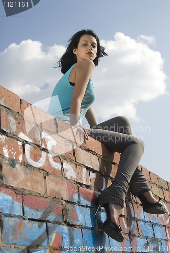 Image of Young woman on roof