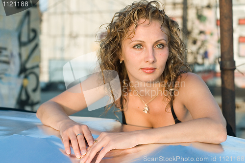 Image of Young woman on roof