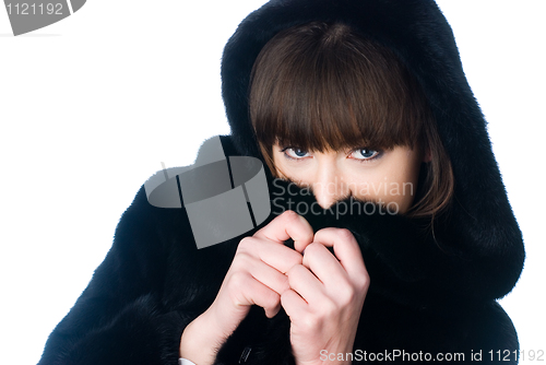 Image of Young woman in fur coat