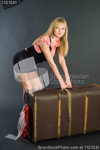Image of Beautiful girl with suitcase