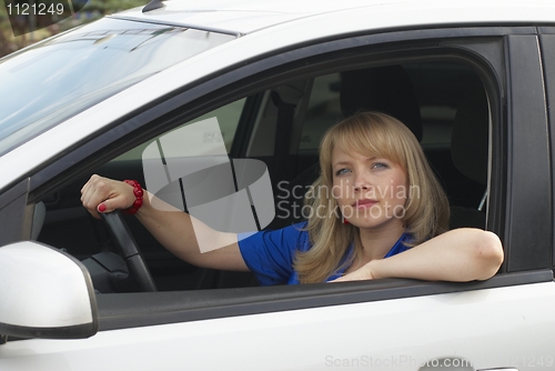 Image of Young woman in car