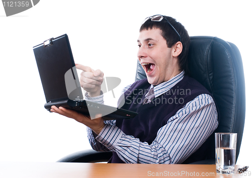 Image of Young businessman with laptop