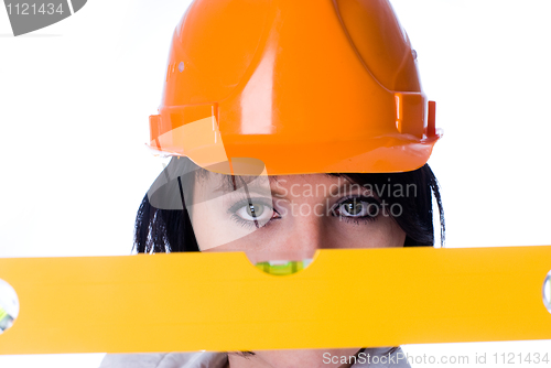 Image of Woman in helmet with level