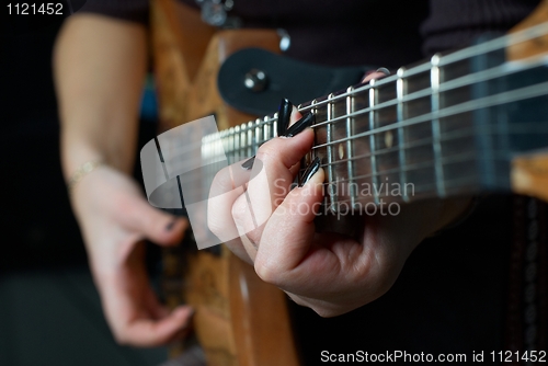 Image of Playing on guitar