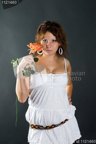 Image of Beautiful girl with flower