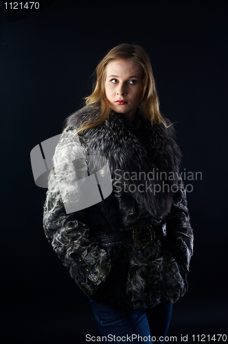 Image of Attractive woman in fur coat