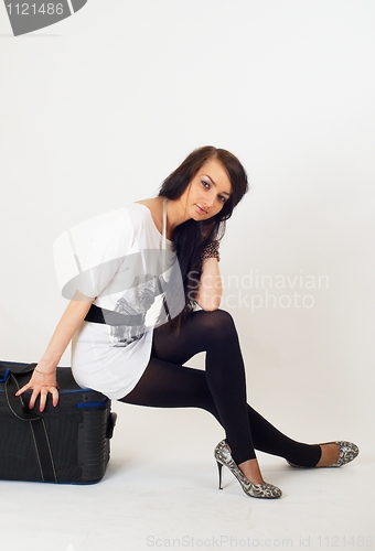 Image of Beautiful girl with suitcase