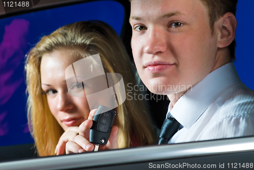 Image of Young couple in car