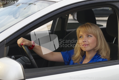 Image of Young woman in car