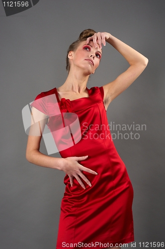 Image of Sexy slim woman in red dress