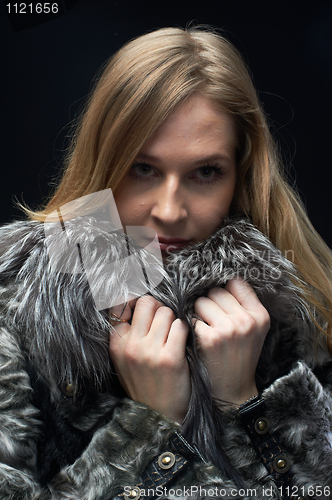 Image of Attractive woman in fur coat