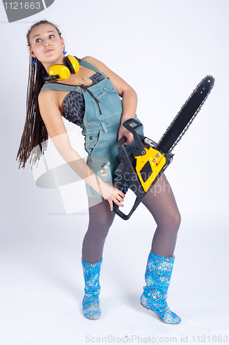 Image of Pretty girl with chainsaw