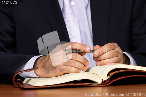 Image of Businessman with notebook