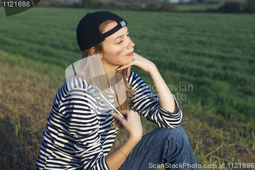 Image of Young Blond Woman With Her Broken Car