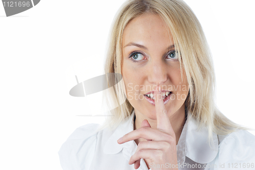 Image of Woman gesturing to silence