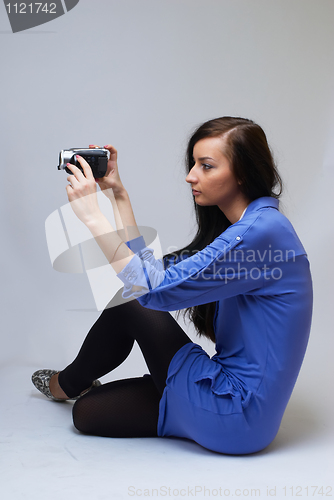 Image of Young woman with camera