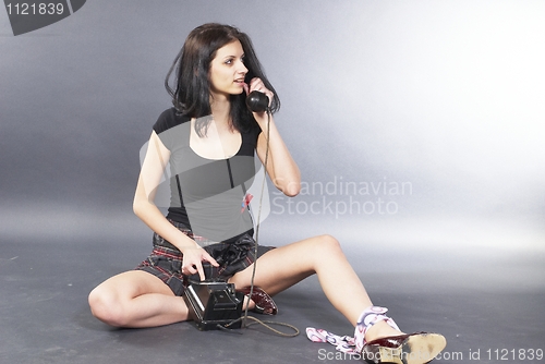 Image of Girl with wire phone