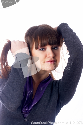 Image of Woman with hands in hair