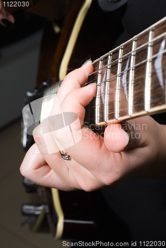 Image of Playing on guitar