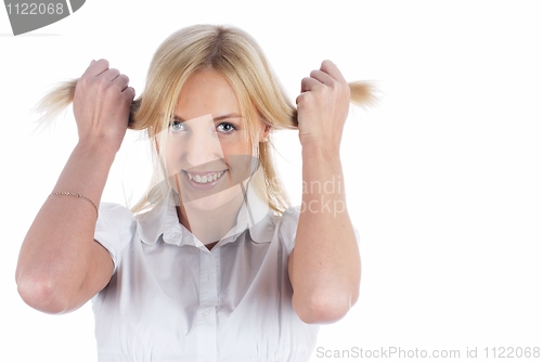 Image of Woman with hands in hair