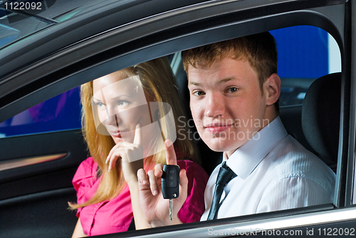 Image of Young couple in car
