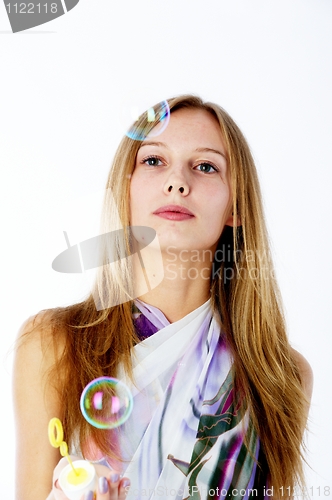Image of Attractive girl with soap bubbles