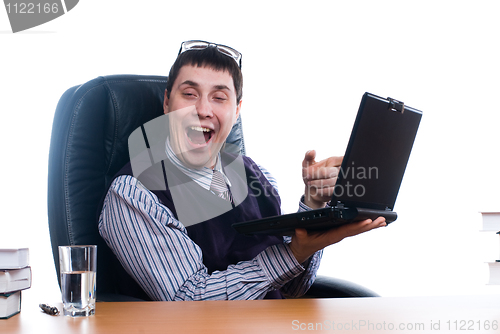 Image of Young businessman with laptop