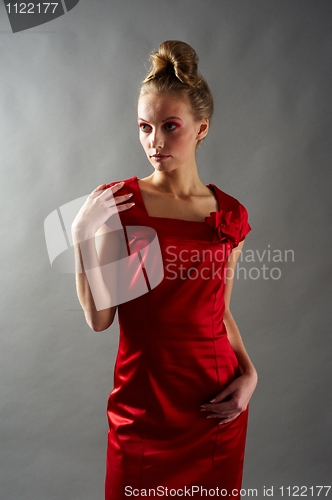 Image of Sexy slim woman in red dress