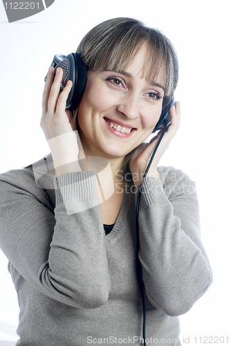 Image of Woman listening music