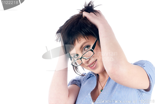 Image of Woman with hands in hair