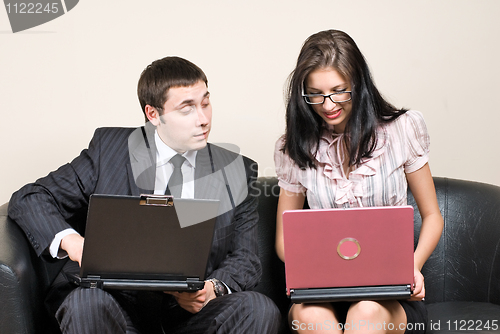 Image of Business people with notebooks