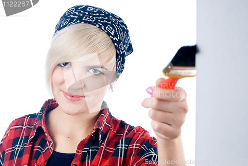 Image of Young woman with paintbrush