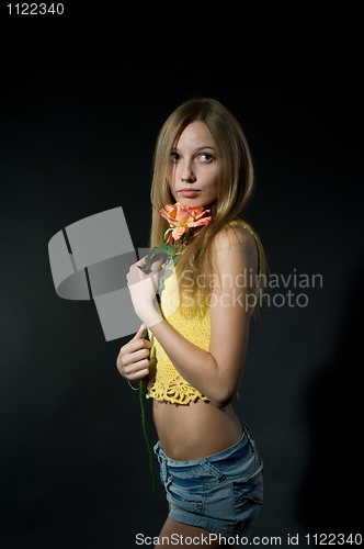 Image of Pretty girl with flower