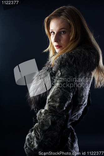Image of Attractive woman in fur coat