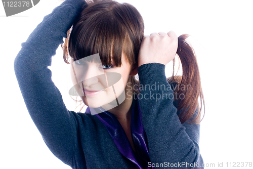 Image of Woman with hands in hair