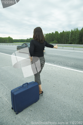 Image of Woman with suitcase