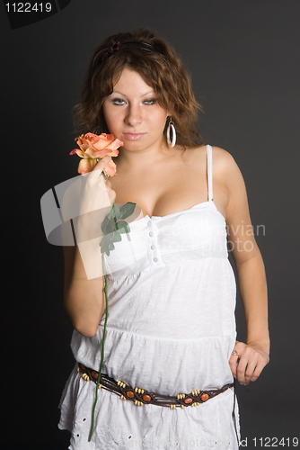 Image of Beautiful girl with flower