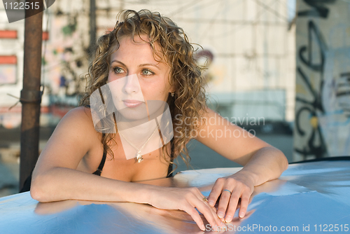 Image of Young woman on roof