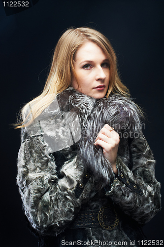 Image of Attractive woman in fur coat