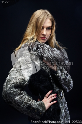 Image of Attractive woman in fur coat