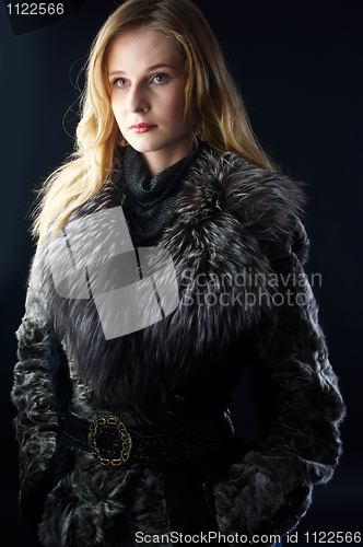 Image of Attractive woman in fur coat