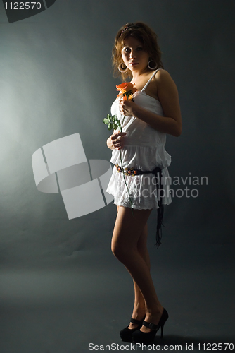 Image of Beautiful girl with flower