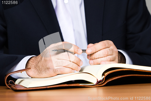 Image of Businessman with notebook