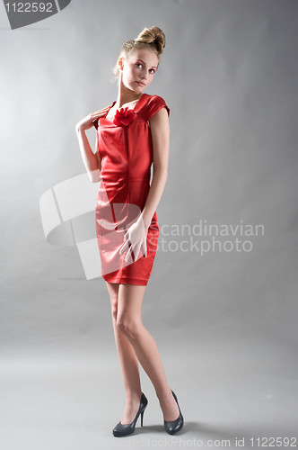 Image of Sexy slim woman in red dress