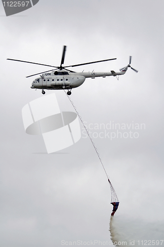 Image of Helicopter over fire