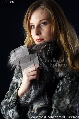 Image of Attractive woman in fur coat