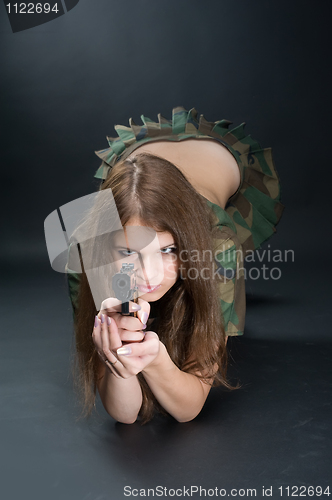 Image of Pretty woman with a gun