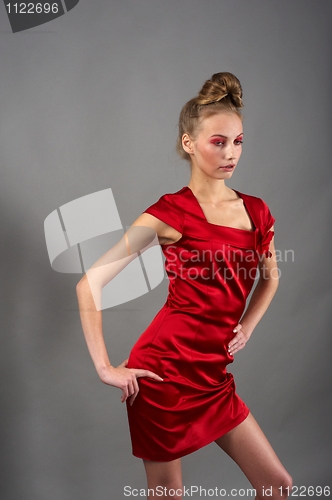 Image of Sexy slim woman in red dress