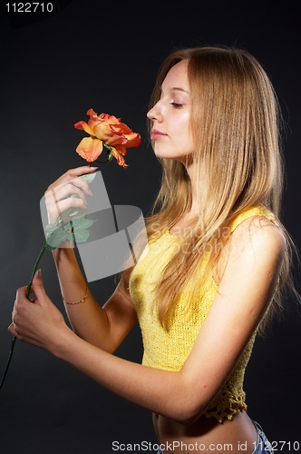 Image of Pretty girl with flower