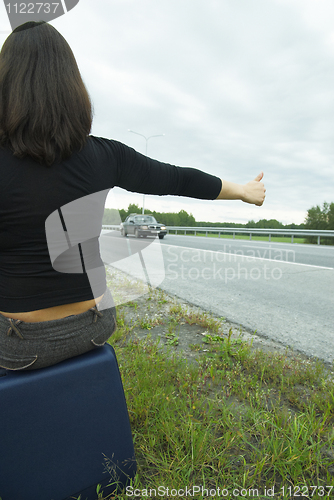 Image of Woman with suitcase